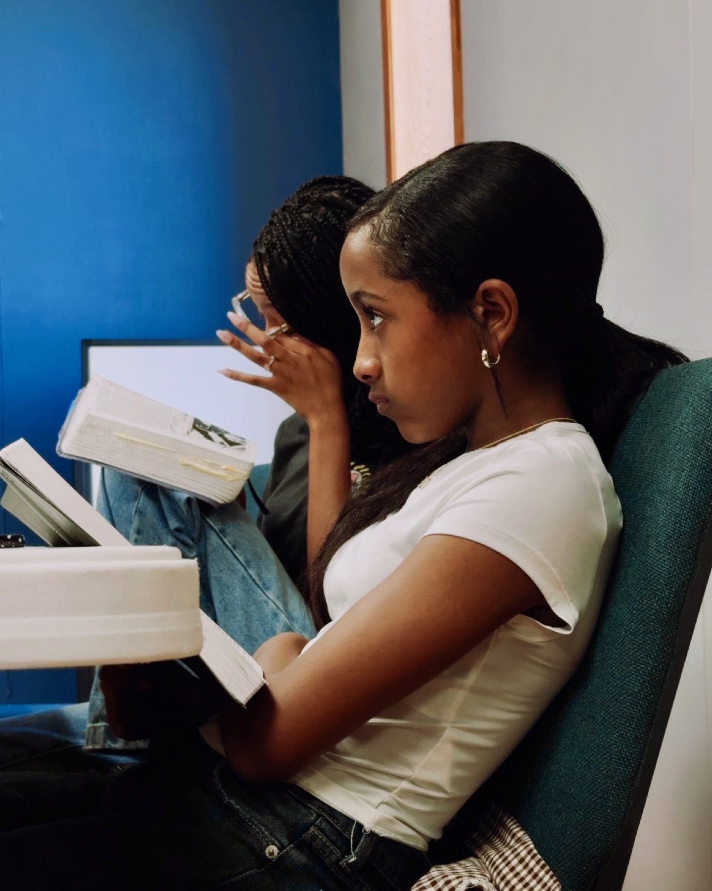 Youth reading Scripture during Bible study