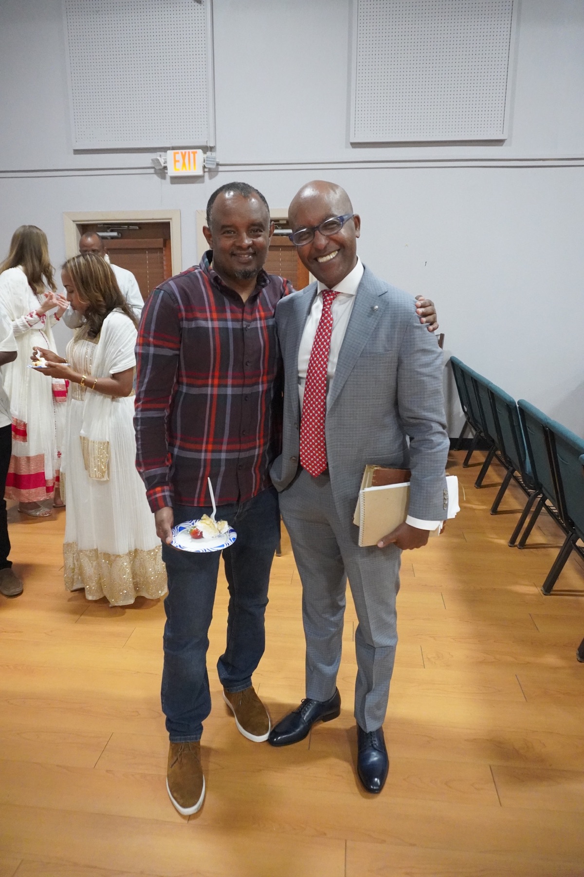 Men smiling for a fellowship photo
